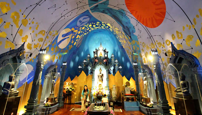 Ancient Buddha statues line the sides, and relics and a shrine are the focal point of this room - all under the vault of the cosmos, and all within the body of the Elephant