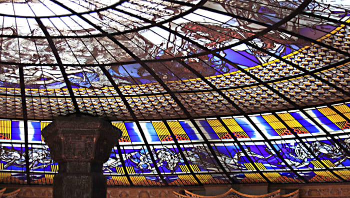 The glass ceiling of the pedestal, and the top of one of the four supporting pillars