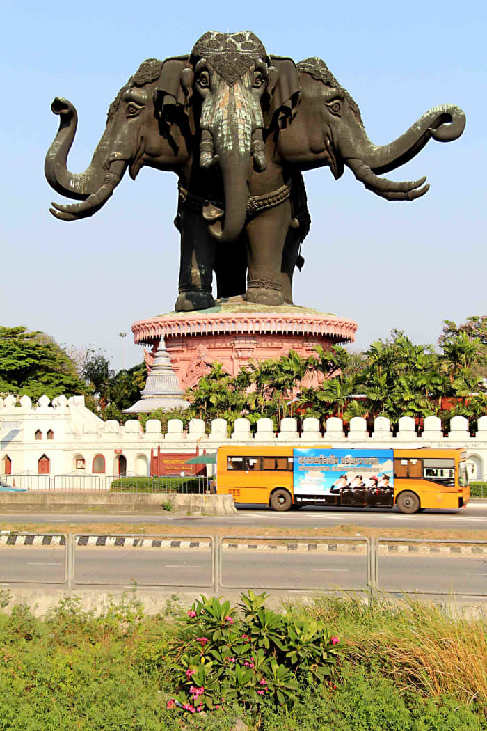 The Erawan Museum. The sheer size and domination of this extraordinary building over the neighbourhood is made apparent by the passing yellow bus, which it dwarfs