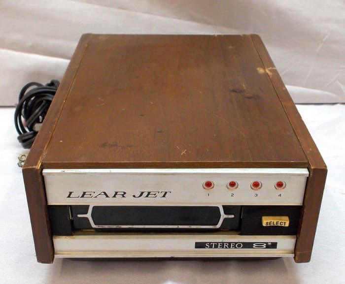 At home, use the Lear Jet 8 track full dimensional stereophonic reproduction through your present home stereo system by plugging in this handsomely crafted Lear Jet home tape deck.