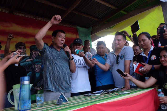 The New People's Army releases its captive Philippine National Police officers to then Mayor Rodrigo Duterte.