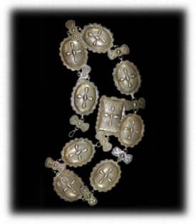 Original Navajo jewelry work and silversmithing without turquoise. Notice the stamping on the jewelry which is Navajo art.