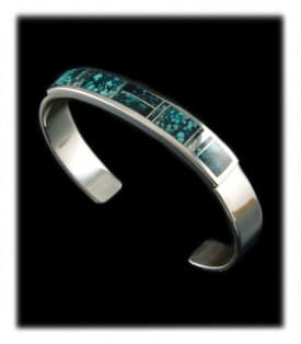 Turquoise and silver inlay cuff bracelet made by Navajo Native American Stanley Manygoats of New Mexico.