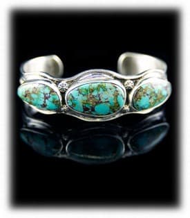 Bisbee Turquoise Bracelet. Three bezel turquoise stones soldered on top of a silver stamped bracelet frame. Named Bisbee for the Bisbee turquoise mine in Arizona.