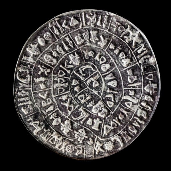 The Phaistos Disc was discovered by the Italian archeologist Luigi Pernier in 1908, near the Minoan palace of Phaistos. The disc is believed to have its origins from the late Minoan Bronze Age. It is 15 cm wide.