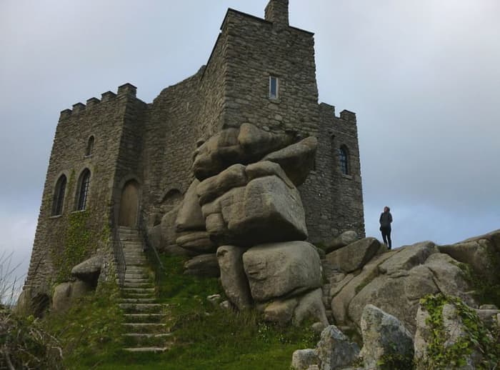 Carn Brea Castle on Carn Brea is a 14th-century granite stone building which was extensively remodelled in the 18th century as a hunting lodge in the style of a castle for the Basset family.