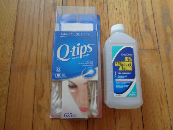 I like to use the stronger 91% rubbing alcohol when cleaning heads and rollers. I'm always careful as to not drop any loose cotton into the deck, and always wait a while for everything to dry before using.