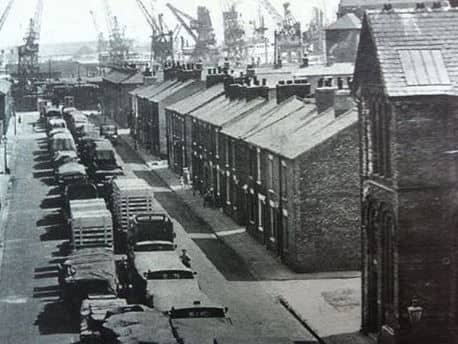 "There's a big ship in our back yard!" Near ground level, this is Lower East Street, where columns of commercial vehicles await their turn to access the warehouses with goods inward or outward