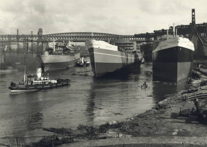 Three Sunderland-built ships await fitting-out after launch on the River Wear
