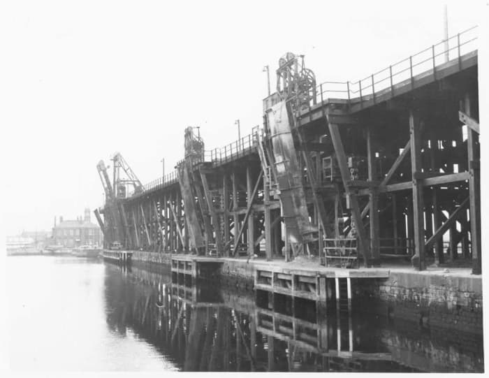 The coal staiths at Hartlepool - gravity unloading into ships from as far off as the Baltic was facilitated by hoppers under the rail deck. Behind is the Dock Master's Office
