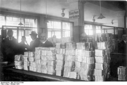 German hyperinflation, as seen by these huge stacks of paper money awaiting distribution, is often blamed as a direct result of reparations imposed by the Treaty of Versailles, but stems more from German internal politics and responses.