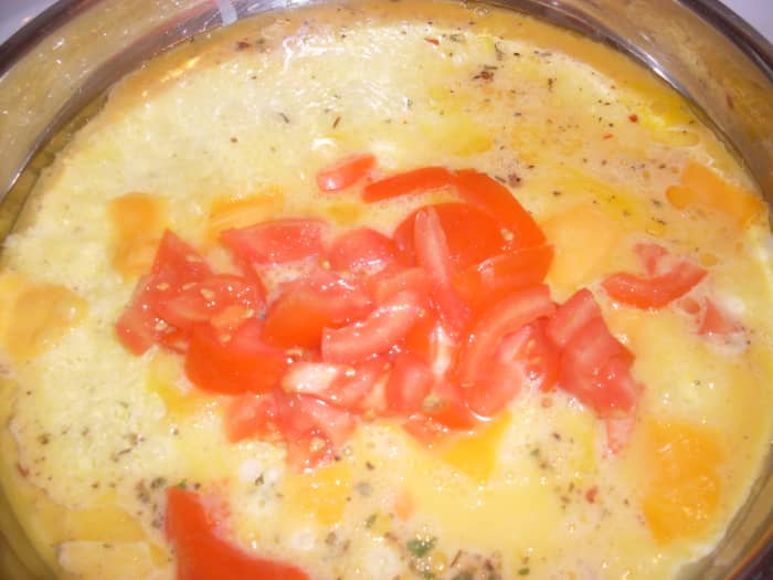 For making the ultimate breakfast burrito with bacon: eggs, pieces of tomatoes and a few assorted spices such as oregano