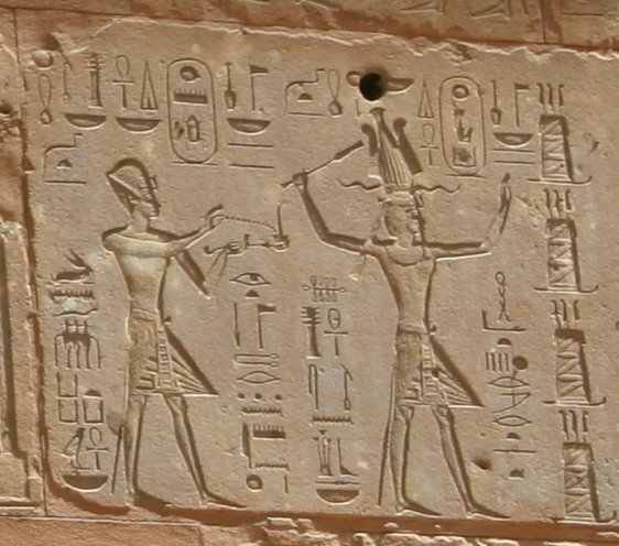Hieroglyphs showing Thutmose III on the left and Hatshepsut on the right, she having the trappings of the greater role — Red Chapel, Karnak.