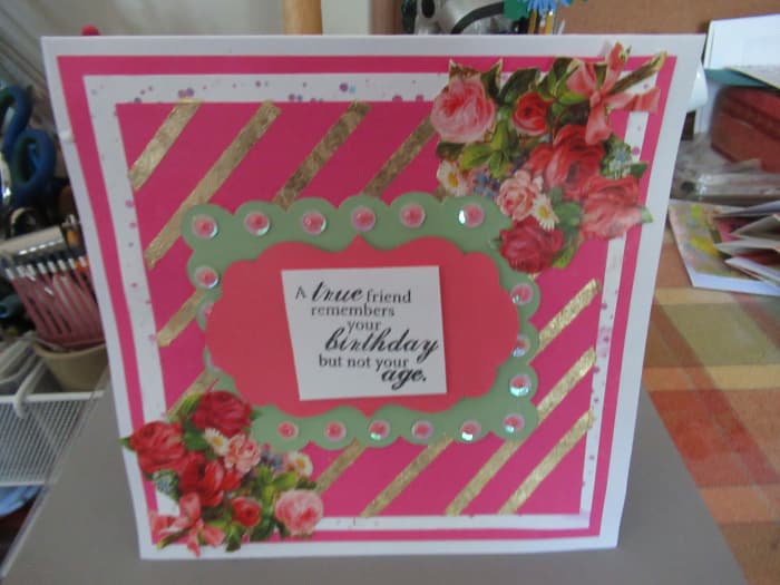 There are so many ways that you can use gilding flakes. This card uses stripes of double sided tape to greate stripes