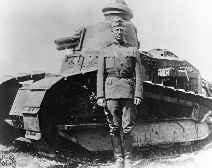 Patton at Bourg in France in 1918 with a Renault FT light tank. He was know in the First World War as a hard charging tank commander. He used his tanks as if it was a hores in the calavry.