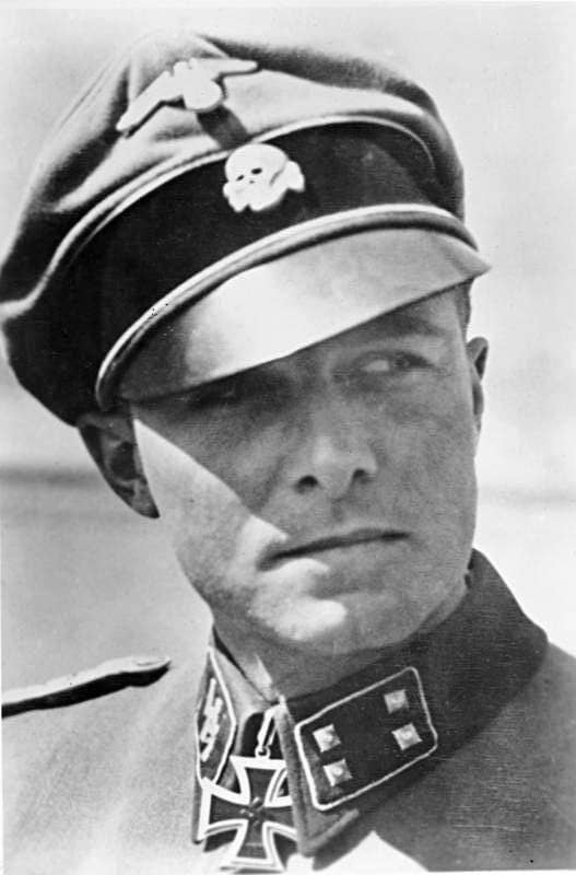 Colonel Jochim Peiper in his 1st SS Panzer Division "Leibstandarte" Adolf Hitler uniform. The Death's Head insignia on his cap signifies loyalty to the death for the Fuhrer Adolf Hitler. He spoke excellent English.