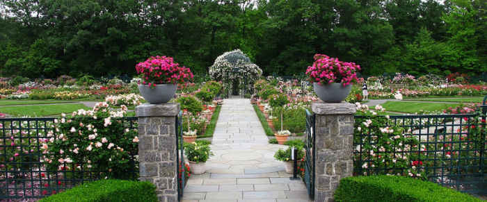 A typical garden perspective at the NY Botanical Garden entered by ornamental gateway