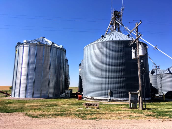 This grain bin cluster was assembled over several years' time, and includes bins of different eras and makes, with varying foundation requirements. Pits, drying floors, and other set-ups are included.