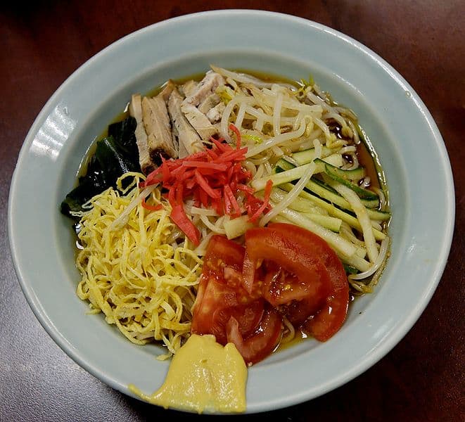 Ramen in Paris -- This cold dish is of noodles, pork, omelette shreds, wakame seaweed and cucumber in a vinegar base sauce or soup. (public domain)
