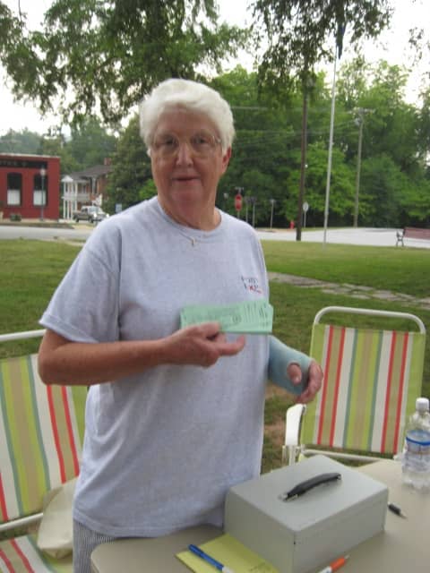 Friends of the Park - Even with a broken arm, Caroline is working hard promoting Freedom Fest on July 2