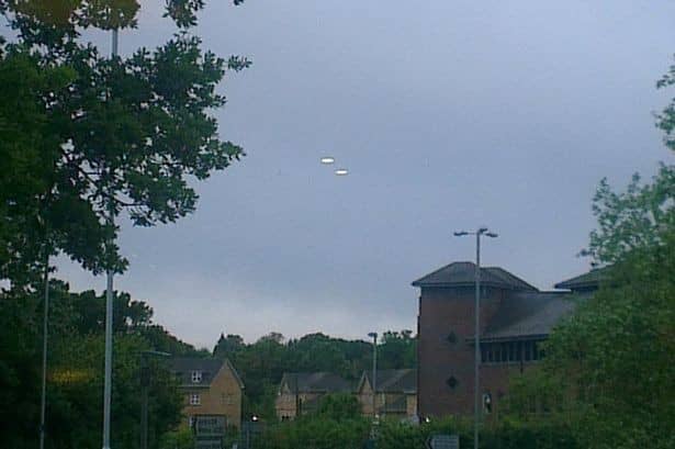 Steve Lambert caught these two UFOs on camera hovering over the skies of Bracknell, Berkshire, on the night of Friday 14 June, 2013. "They were heading south-west at high speed towards Basingstoke - quicker than any normal aircraft.