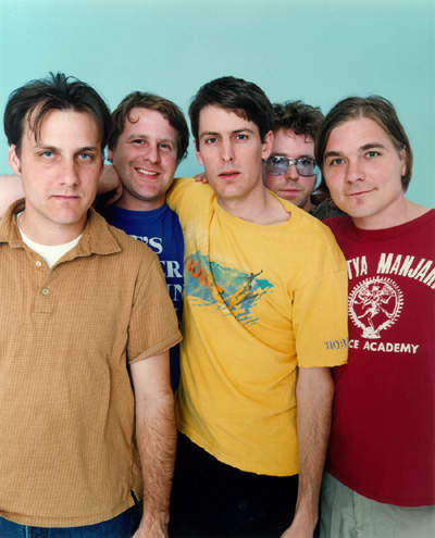Steve Malkmus, the singer and main songwriter is wearing the yellow shirt. (image from: www.starpulse.com)