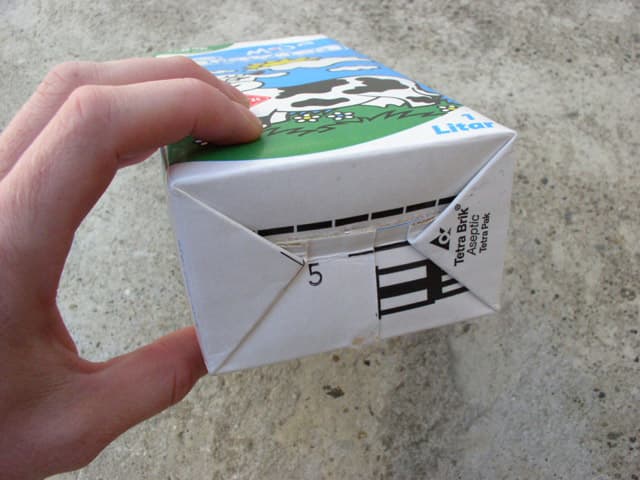 Try to find a package of the model Tetra Brik by the company Tetra Pak. These are the most common packages and the best to create a recycling wallet.