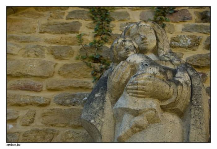And the infant was also carved in an unusual way. He appeared to be squirming out of the girl's hands and smiling with the mischief of it all.