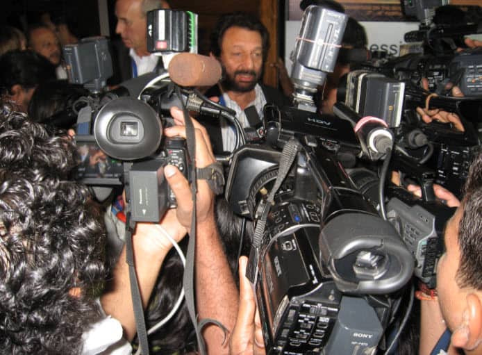 Media frenzy creating entertainment and news; photographer all over the breaking news like ants on a victim