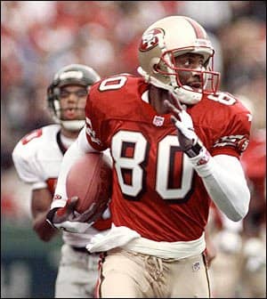 Jerry Rice breaks away from an Atlanta Falcons defender on a 66-yard TD run during the first quarter in playing for the 49 ners in 1998. (Sept. 27, 1998)