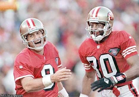 49ers QB Steve Young and Rice rushed to congratulate tight end Brent Jones after Jones scored a touchdown, on November 13, 1994. Associated Press photo by Susan Ragan