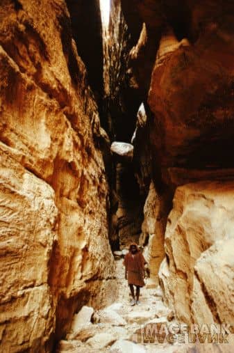 High in the cliffs above the Dogon village where we see the brother of the Hogon walking between the rocks to assist with a burial, Bandiagara Escarpment, Mali- 1994