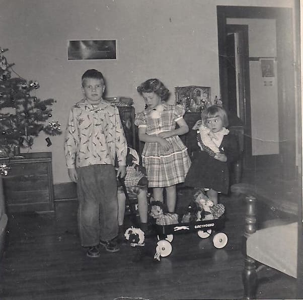 Here I am with all my siblings with our homemade gifts. What a happy Christmas we had. Mom made me a new dress and some stuffed toys for my sisters.