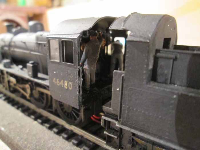 Cab view of 46480 (a Bachmann Branchlike model) shows driver on the left at the controls, fireman on the right looks out for signals the driver can't see on a right-hand curve