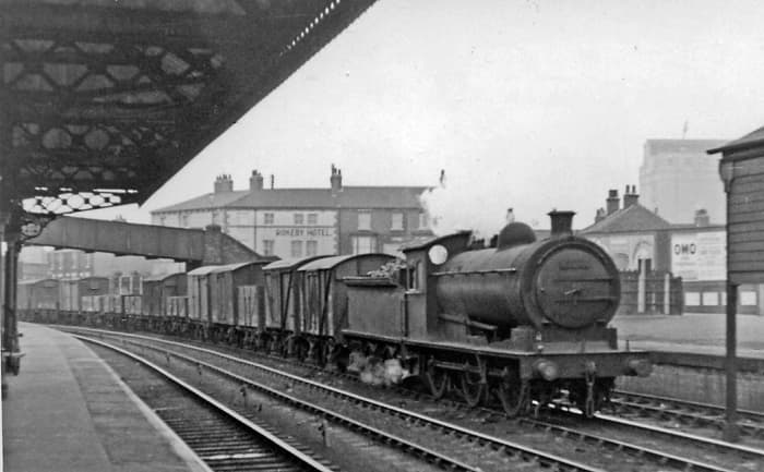 Class J26 65774 passes through Thornaby station in BR days with a long Down freight. In 1950 she was a Newport (51B) engine, transferred 1958 to the newly opened Thornaby (51L) shed, withdrawn before or by June, 1962