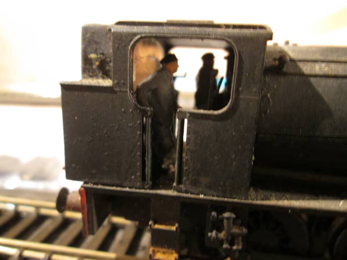 68010 close-up with fireman resting after topping up the grate, driver - far side - makes adjustments