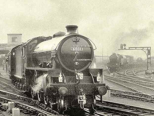 Class B1 4-6-0 61031 'Reedbuck' brings a Railway Correspondence & Travel Society (RCTS) special around York station in the 1960s - one of the platforms added to cope with wartime traffic. A goods working awaits the 'right away' from the goods yards