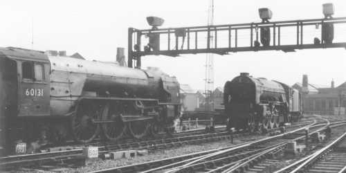 Class A1 60131 'Osprey' enters the picture from left as an unidentified sister A! rounds the curve on the main line