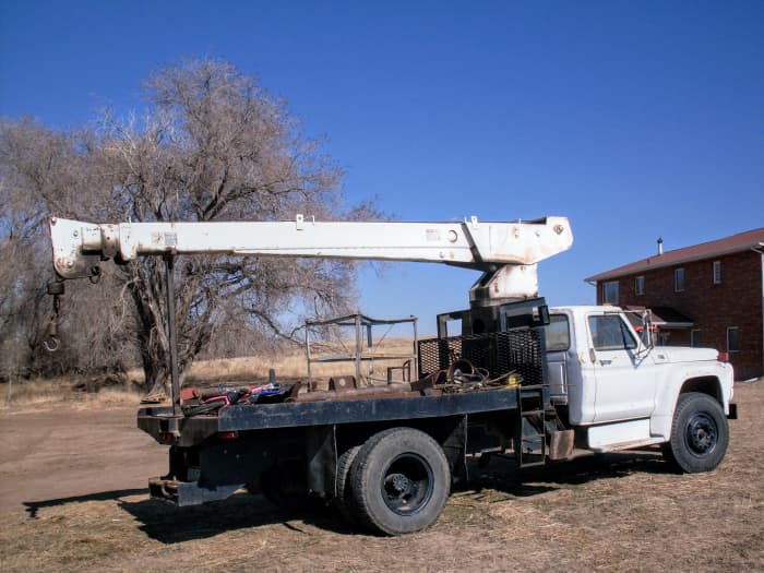 This boom truck belonged to a friend, and was our work partner for several years. It helped move, tear down and set up many grain bins.