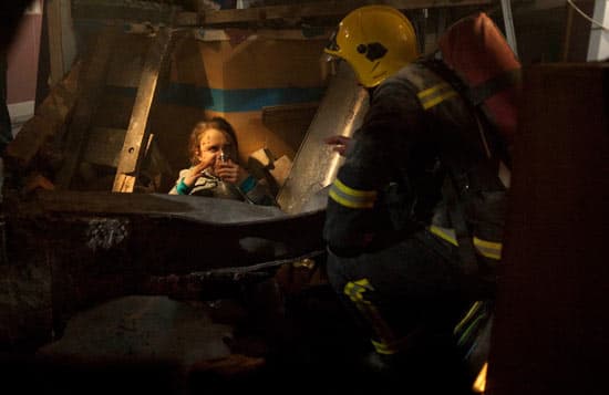 Fire fighters have saved baby Jack from the rubble and are fighting to to get his Mum Molly out