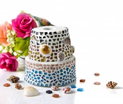 Children love to decorate flower pots. Inexpensive, variety of sizes and choices of glass. Available at craft stores everywhere. Grandmas love this gift.