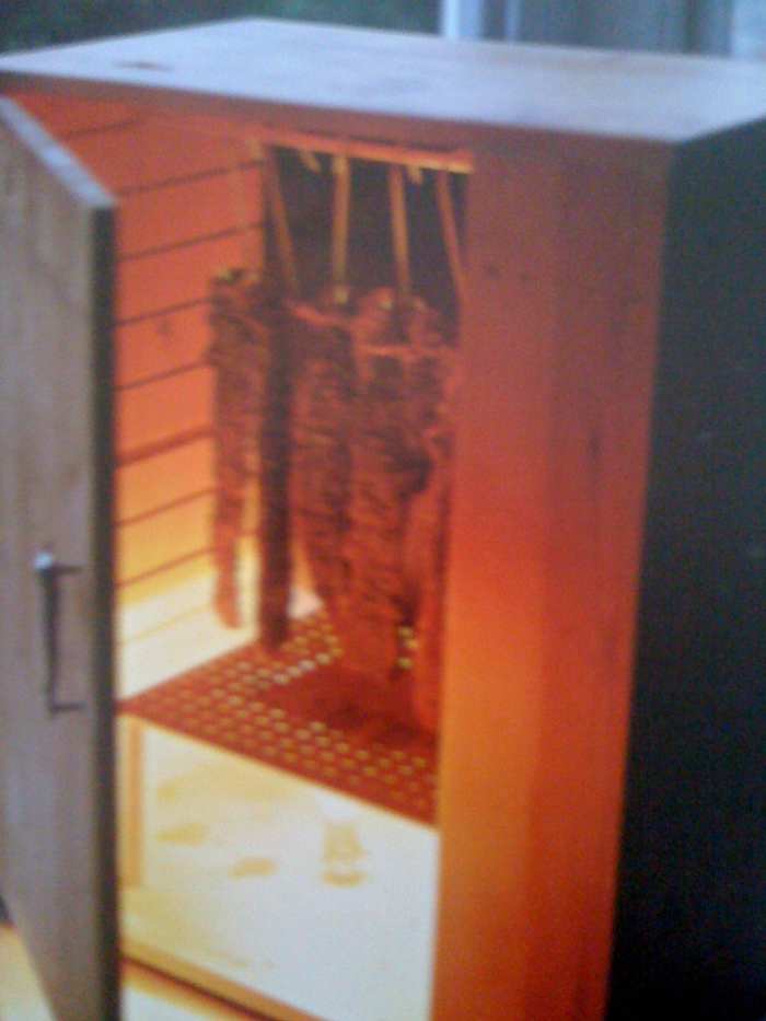 Note the perforated wood that I have used to protect the light bulb in this biltong drying box.