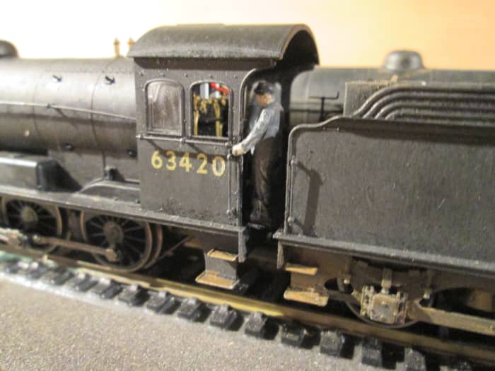 Close-up of 63420 with the fireman holding on, watching out for a signal the driver can't see in good time from his side...