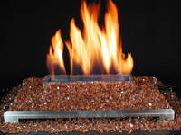 copper glitter fire ventless gas fireplace with highly reflective crushed glass. very beautiful with a stainless steel unvented burner and hidden control valves.