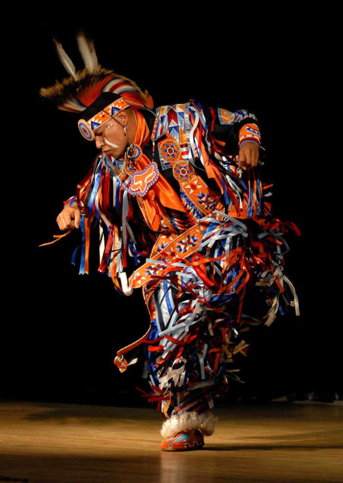 Arlen Whitebreast, with Native Pride Productions, performs a tribal dance to entertain guests at Joint Base-Myer Henderson Hall in celebration of Native American Indian Heritage Month. 11/20/2009