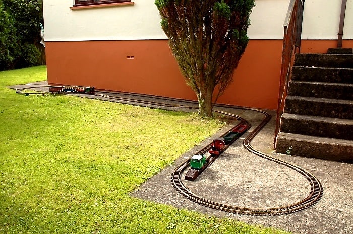 While only small, and limited operationally, a Temporary Garden Railroad can provide enough to maintain interest until a more permeant one be built - David Lloyd-Jones 2010