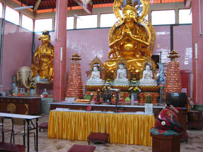 Inside the temple, offerings of fruit and flowers are placed on alters to please Buddha and bring good fortune.