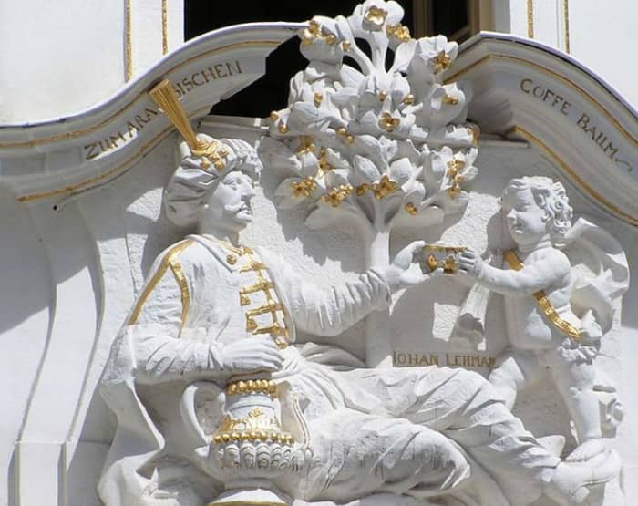 Over the door of a Leipzig coffeeshop is a sculptural representation of a man in Turkish dress, receiving a cup of coffee from a boy. source Wikipedia - history of coffee mugs