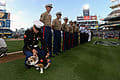 US Navy Marine fixes uniform on the Marine corps bulldog mascot