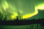 It is common to view northern lights that appear to be swirling in nature. They result from solar flares skipping off of and around the earths magnetic shield. Northern lights are more common in regions further north, like the one here near Alaska.